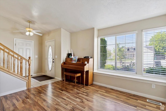 4135 W 4850 S, Roy, UT 84067 - entrance foyer with wood finished floors, baseboards, stairs, and a ceiling fan