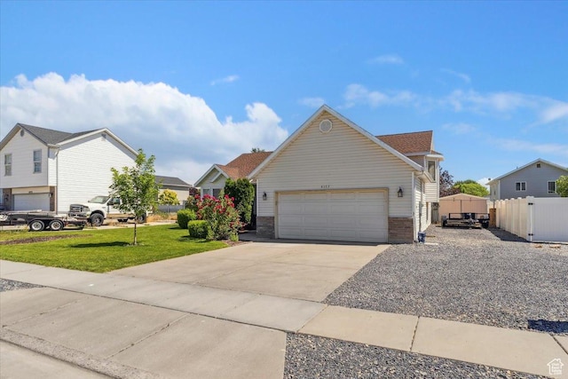 4135 W 4850 S, Roy, UT 84067 - view of front facade with concrete driveway, a garage, and brick siding