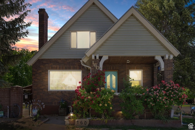 160 S 200 W, Tooele, UT 84074 - view of front of home with a chimney and brick siding