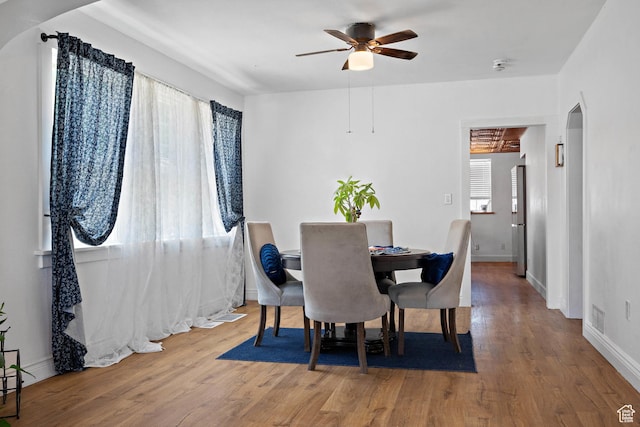 160 S 200 W, Tooele, UT 84074 - dining area with a ceiling fan, wood finished floors, arched walkways, and baseboards