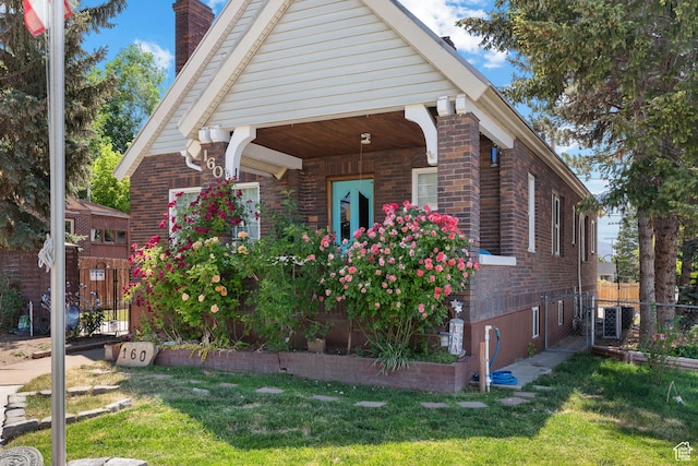 160 S 200 W, Tooele, UT 84074 - view of home's exterior with a chimney and brick siding