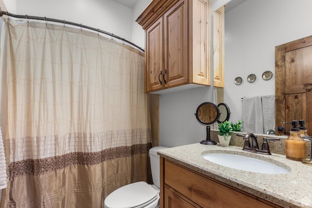 1560 Reserve Dr, Fish Haven, ID 83287 - bathroom featuring vanity, toilet, and a shower with shower curtain