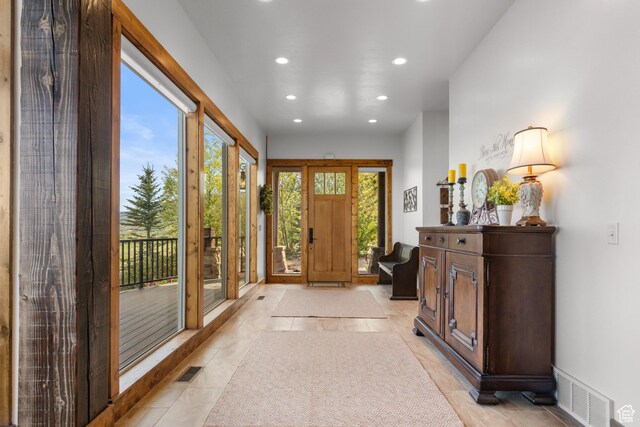 1560 Reserve Dr, Fish Haven, ID 83287 - foyer with recessed lighting, light tile patterned floors, and baseboards