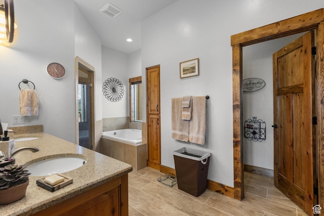 1560 Reserve Dr, Fish Haven, ID 83287 - full bathroom featuring double vanity, a bath, recessed lighting, and baseboards