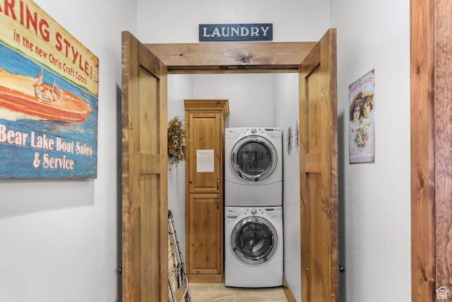 1560 Reserve Dr, Fish Haven, ID 83287 - laundry area featuring estacked washer and dryer and light tile patterned floors