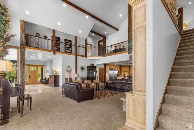 1560 Reserve Dr, Fish Haven, ID 83287 - carpeted living room featuring high vaulted ceiling, stairs, recessed lighting, and beamed ceiling