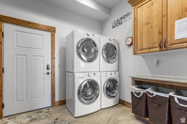 1560 Reserve Dr, Fish Haven, ID 83287 - laundry room with cabinet space, stacked washer and clothes dryer, baseboards, and separate washer and dryer