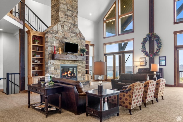 1560 Reserve Dr, Fish Haven, ID 83287 - living room featuring a high ceiling, carpet flooring, a fireplace, and baseboards