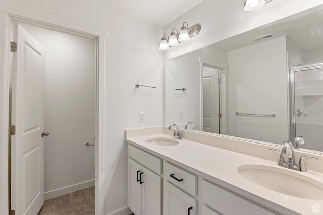 6658 W 11800 S, South Jordan, UT 84009 - bathroom featuring double vanity, a shower with shower door, and baseboards