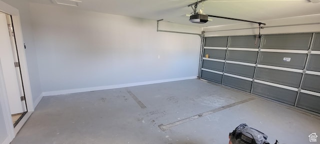 325 W Apple St, Grantsville, UT 84029 - garage featuring a garage door opener and baseboards