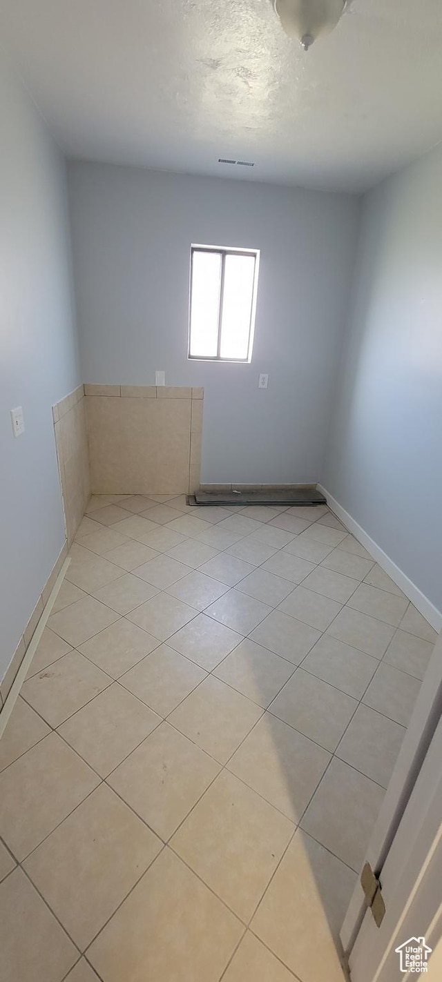 325 W Apple St, Grantsville, UT 84029 - spare room with baseboards and light tile patterned floors