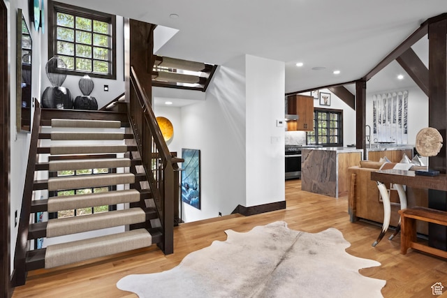8120 Cache Dr Unit 9, Park City, UT 84060 - staircase featuring plenty of natural light, wood finished floors, recessed lighting, and vaulted ceiling