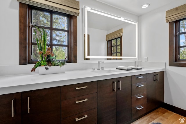 8120 Cache Dr Unit 9, Park City, UT 84060 - full bathroom with double vanity, wood finished floors, and baseboards