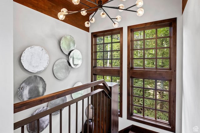 8120 Cache Dr Unit 9, Park City, UT 84060 - staircase featuring a chandelier and plenty of natural light