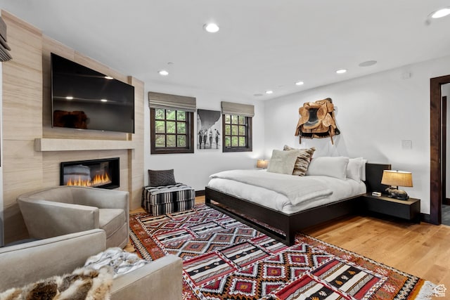 8120 Cache Dr Unit 9, Park City, UT 84060 - bedroom with wood finished floors, baseboards, recessed lighting, and a fireplace