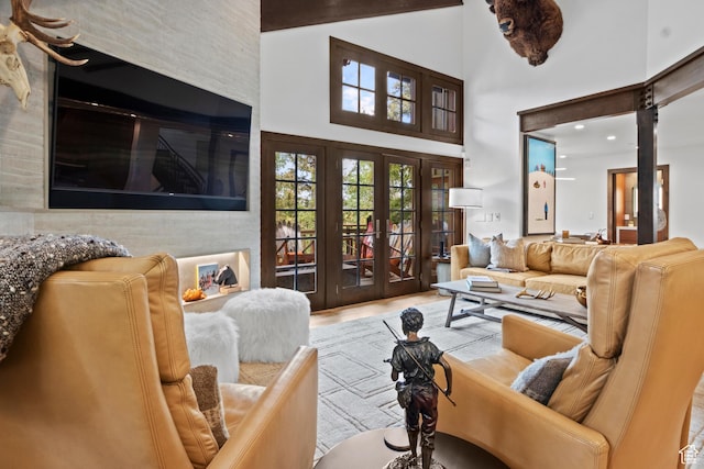8120 Cache Dr Unit 9, Park City, UT 84060 - living area featuring a towering ceiling, french doors, and wood finished floors