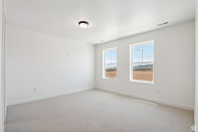 6656 W 11800 S Unit 619, South Jordan, UT 84009 - unfurnished room with baseboards and light carpet