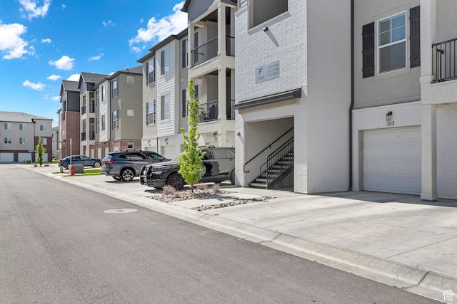 3722 W 1440 N Unit F301, Lehi, UT 84043 - view of building exterior with an attached garage and a residential view