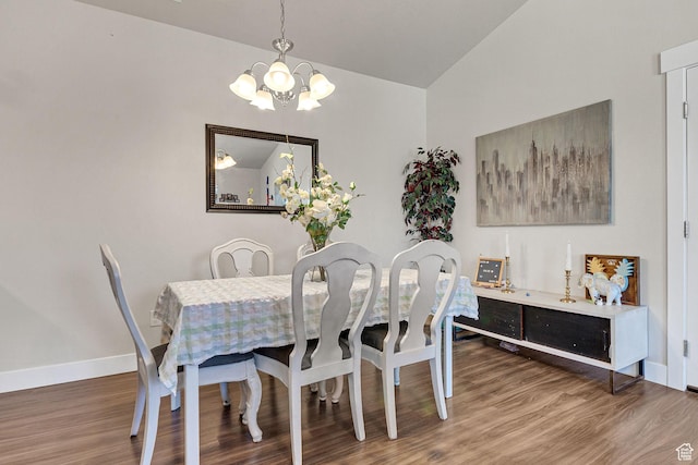 3722 W 1440 N Unit F301, Lehi, UT 84043 - dining space featuring a chandelier, vaulted ceiling, wood finished floors, and baseboards
