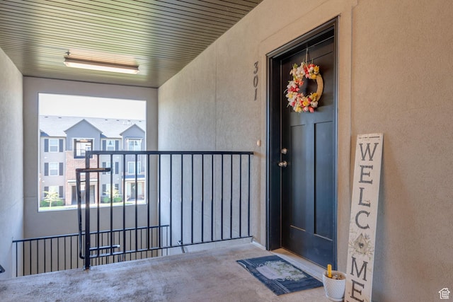 3722 W 1440 N Unit F301, Lehi, UT 84043 - view of exterior entry with stucco siding and a balcony