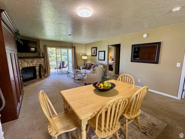 815 N Harbor Dr Unit 201, Garden City, UT 84028 - carpeted dining area featuring a textured ceiling and a stone fireplace