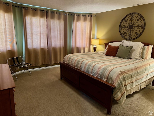 815 N Harbor Dr Unit 201, Garden City, UT 84028 - carpeted bedroom with a textured ceiling