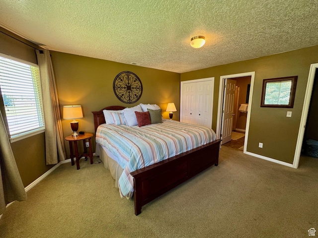 815 N Harbor Dr Unit 201, Garden City, UT 84028 - bedroom featuring a textured ceiling, light carpet, and a closet