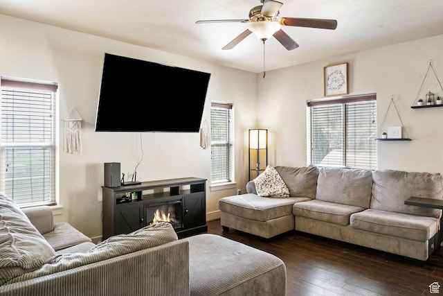 4114 E Cherokee St, Eagle Mountain, UT 84005 - living area featuring dark wood-style floors, ceiling fan, and a glass covered fireplace