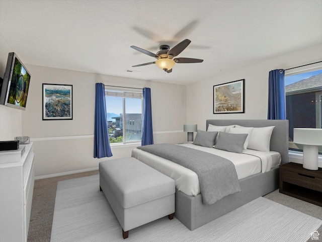 8052 N Clearwater Rd, Eagle Mountain, UT 84005 - bedroom with light carpet and a ceiling fan