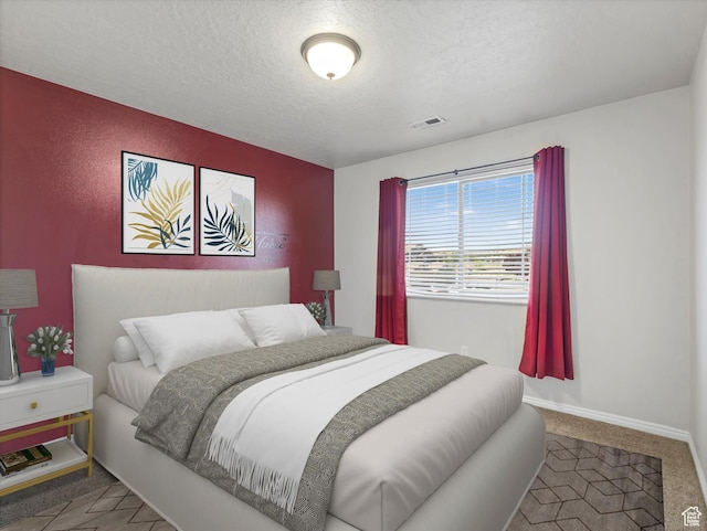 8052 N Clearwater Rd, Eagle Mountain, UT 84005 - carpeted bedroom featuring a textured ceiling and baseboards