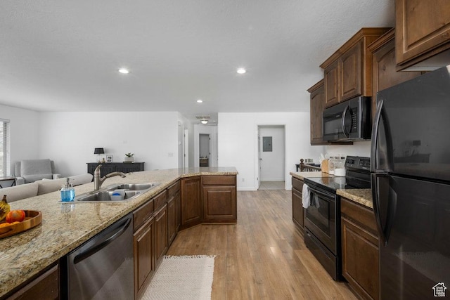 29 E 150 N, American Fork, UT 84003 - kitchen featuring black appliances, a sink, light wood finished floors, baseboards, and recessed lighting