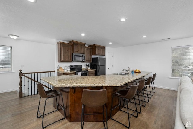 29 E 150 N, American Fork, UT 84003 - kitchen featuring black appliances, baseboards, wood finished floors, a sink, and recessed lighting