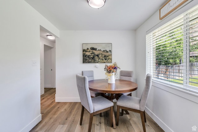 256 N 1040 E, Springville, UT 84663 - dining space with baseboards, healthy amount of natural light, and light wood-style flooring