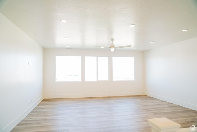 2775 S Rowan Ln, St George, UT 84790 - spare room featuring plenty of natural light, ceiling fan, recessed lighting, light wood-style floors, and baseboards