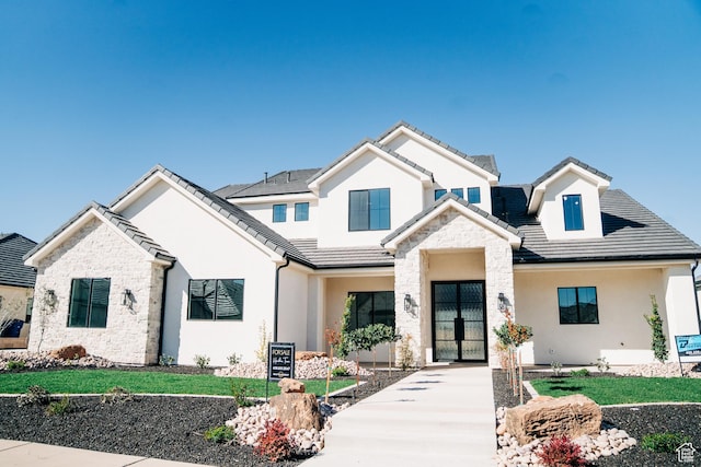 2775 S Rowan Ln, St George, UT 84790 - view of front of home featuring stone siding, stucco siding, and a tiled roof