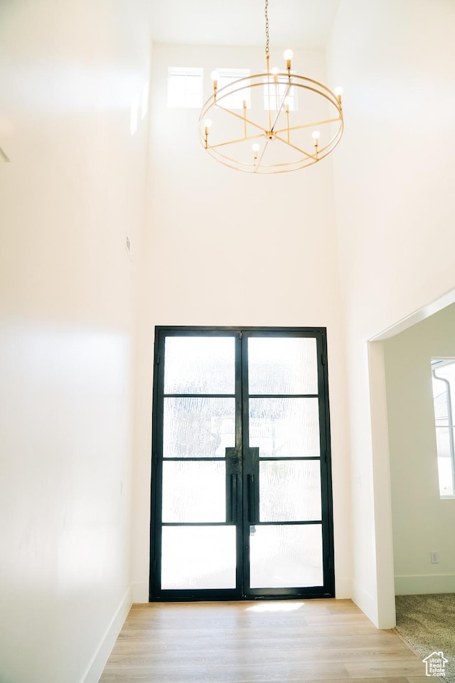 2775 S Rowan Ln, St George, UT 84790 - interior space featuring a chandelier, healthy amount of natural light, french doors, baseboards, and a towering ceiling