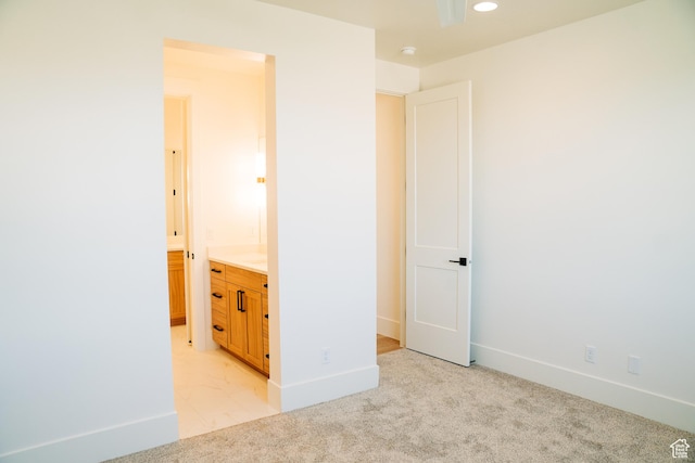 2775 S Rowan Ln, St George, UT 84790 - unfurnished bedroom with light carpet, ensuite bath, baseboards, and recessed lighting