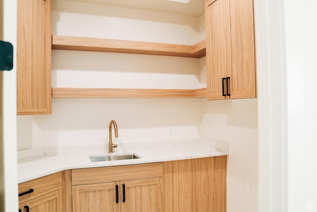 2775 S Rowan Ln, St George, UT 84790 - kitchen with open shelves, a sink, and light brown cabinetry