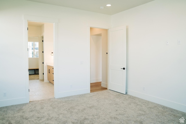 2775 S Rowan Ln, St George, UT 84790 - unfurnished bedroom featuring light colored carpet, baseboards, and recessed lighting