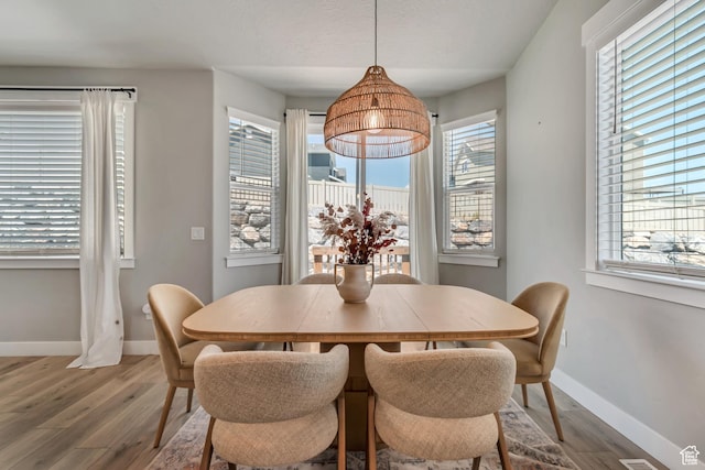 3041 S Hollow Way, Saratoga Springs, UT 84045 - dining area featuring wood finished floors and baseboards