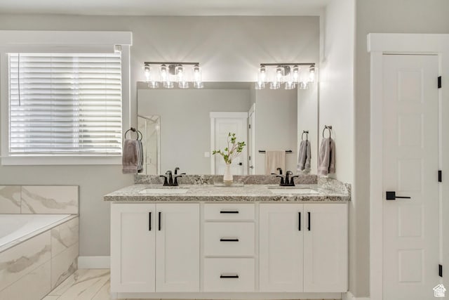 3041 S Hollow Way, Saratoga Springs, UT 84045 - full bath featuring a garden tub, double vanity, a shower with door, baseboards, and marble look tiles