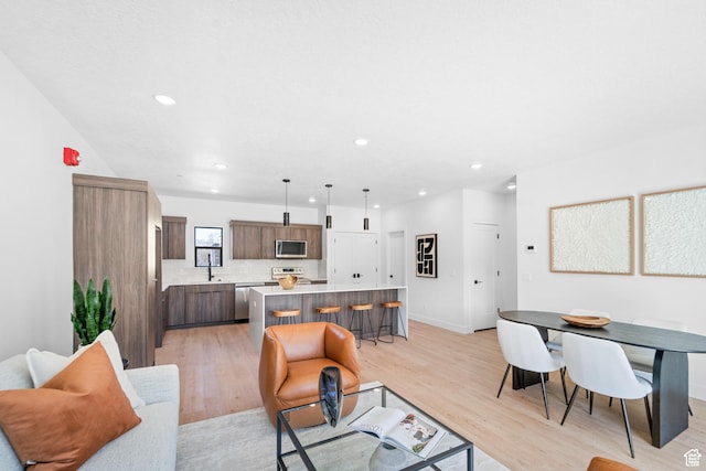 4360 S 900 E, Millcreek, UT 84124 - living room with light wood-type flooring, recessed lighting, and baseboards