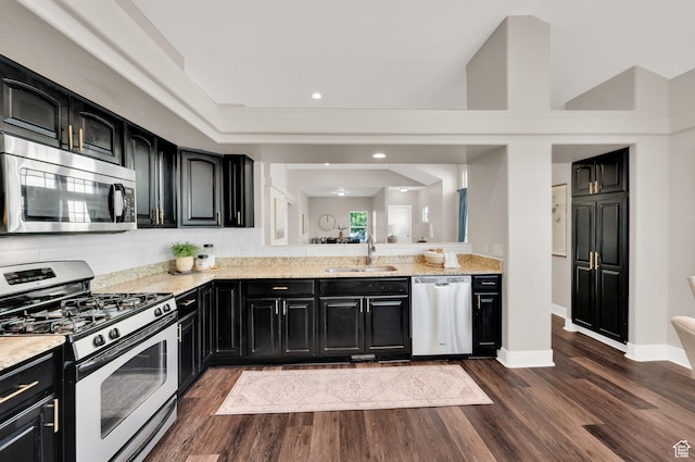 10756 S Navarro Way W, South Jordan, UT 84009 - kitchen featuring stainless steel appliances, dark cabinets, a sink, and recessed lighting