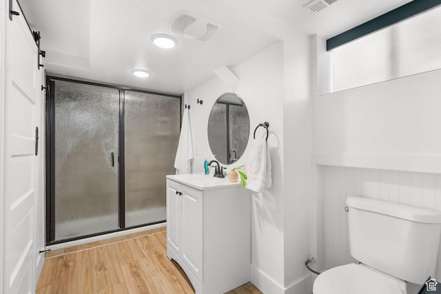 1022 27th St S, Ogden, UT 84403 - full bathroom featuring vanity, wood finished floors, toilet, and a shower stall