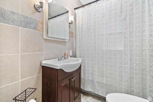 1022 27th St S, Ogden, UT 84403 - bathroom with tile walls, vanity, toilet, and a shower with shower curtain