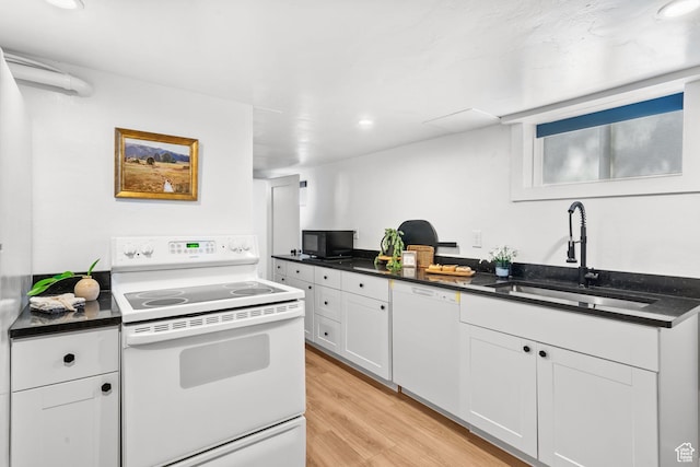 1022 27th St S, Ogden, UT 84403 - kitchen with white appliances, a sink, dark countertops, light wood-type flooring, and white cabinets