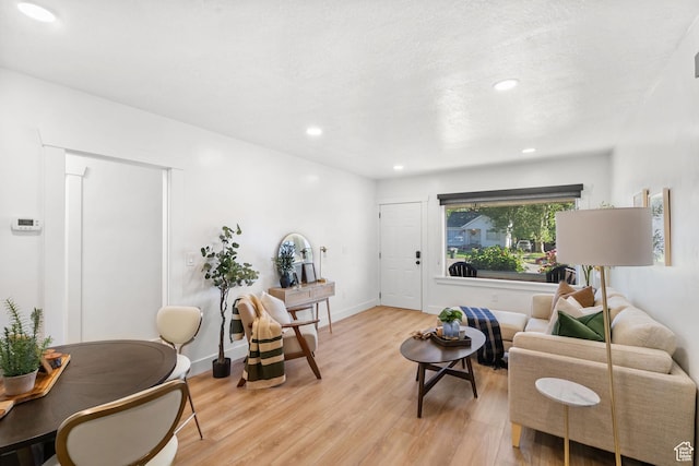 1022 27th St S, Ogden, UT 84403 - living room featuring light wood finished floors, recessed lighting, and baseboards