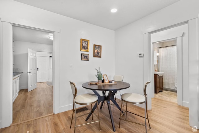 1022 27th St S, Ogden, UT 84403 - dining area featuring light wood-type flooring and baseboards
