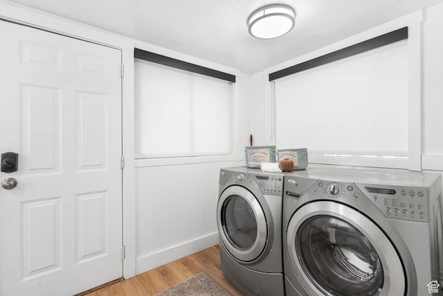 1022 27th St S, Ogden, UT 84403 - laundry room with separate washer and dryer, light wood-style flooring, and baseboards