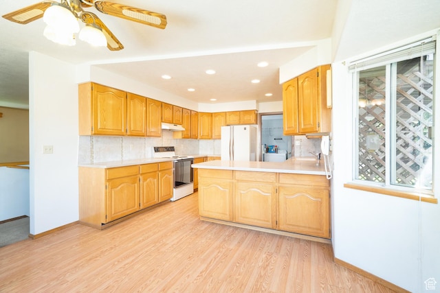 649 W Bulldog Cir, Murray, UT 84123 - kitchen featuring white appliances, backsplash, light countertops, under cabinet range hood, and recessed lighting